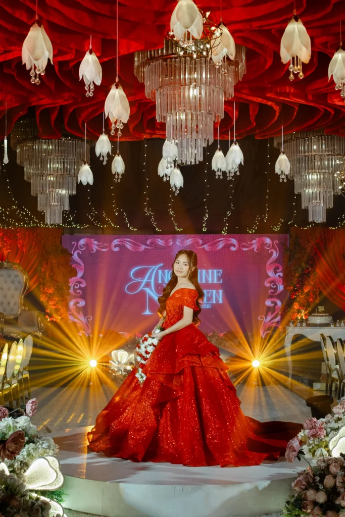 debutant in red gown at the reception
